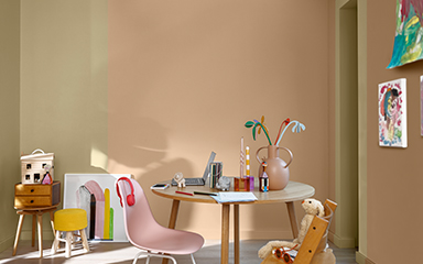 child's room with a vertical split wall in soft orange and straw-yellow