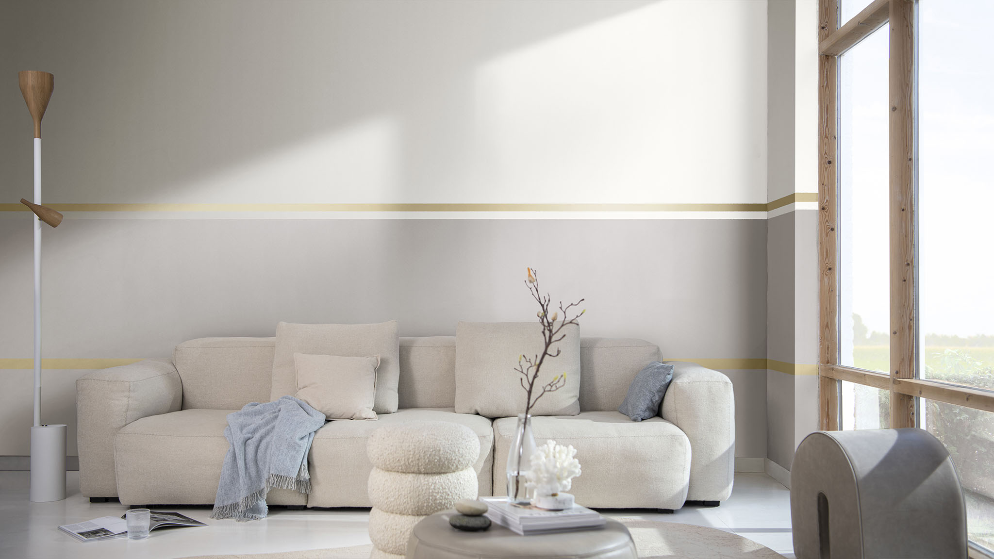 以一条分隔线条凸显墙面分色效果的客厅；右侧紧邻一面大落地窗