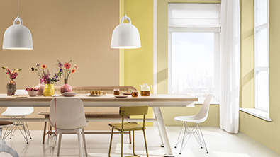 Dining area with peach, yellow and straw-colored walls