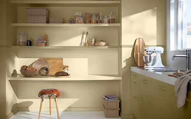Kitchen with straw yellow shelving