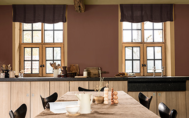 Kitchen with windows in warm brown wall